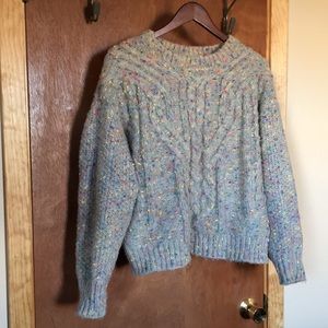 Playful cable knit sweater